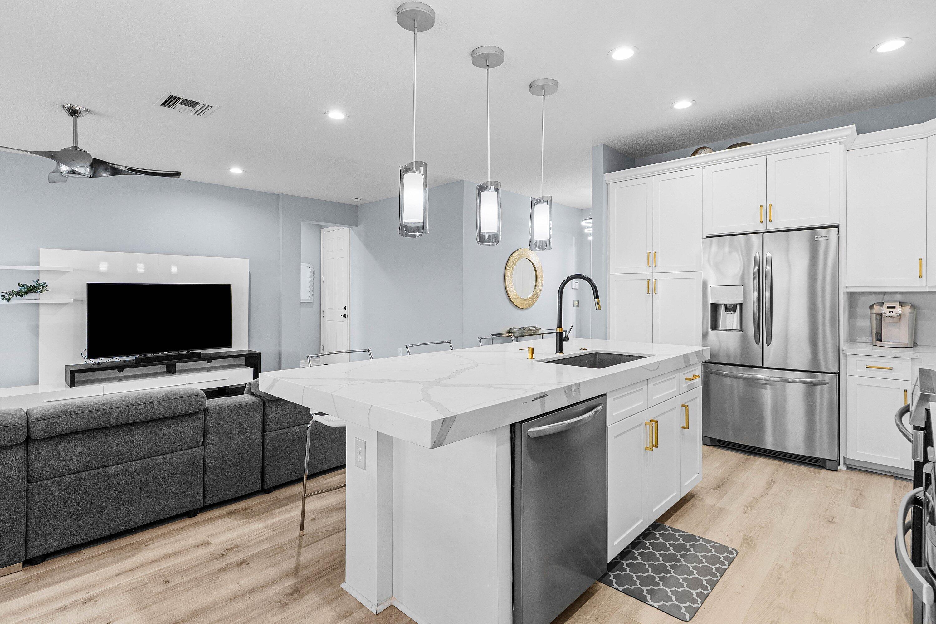 14125 Rock Salt Road Delray Beach, FL 33446 - Photo 12 of 55 a view of kitchen with stainless steel appliances kitchen island a sink and a refrigerator