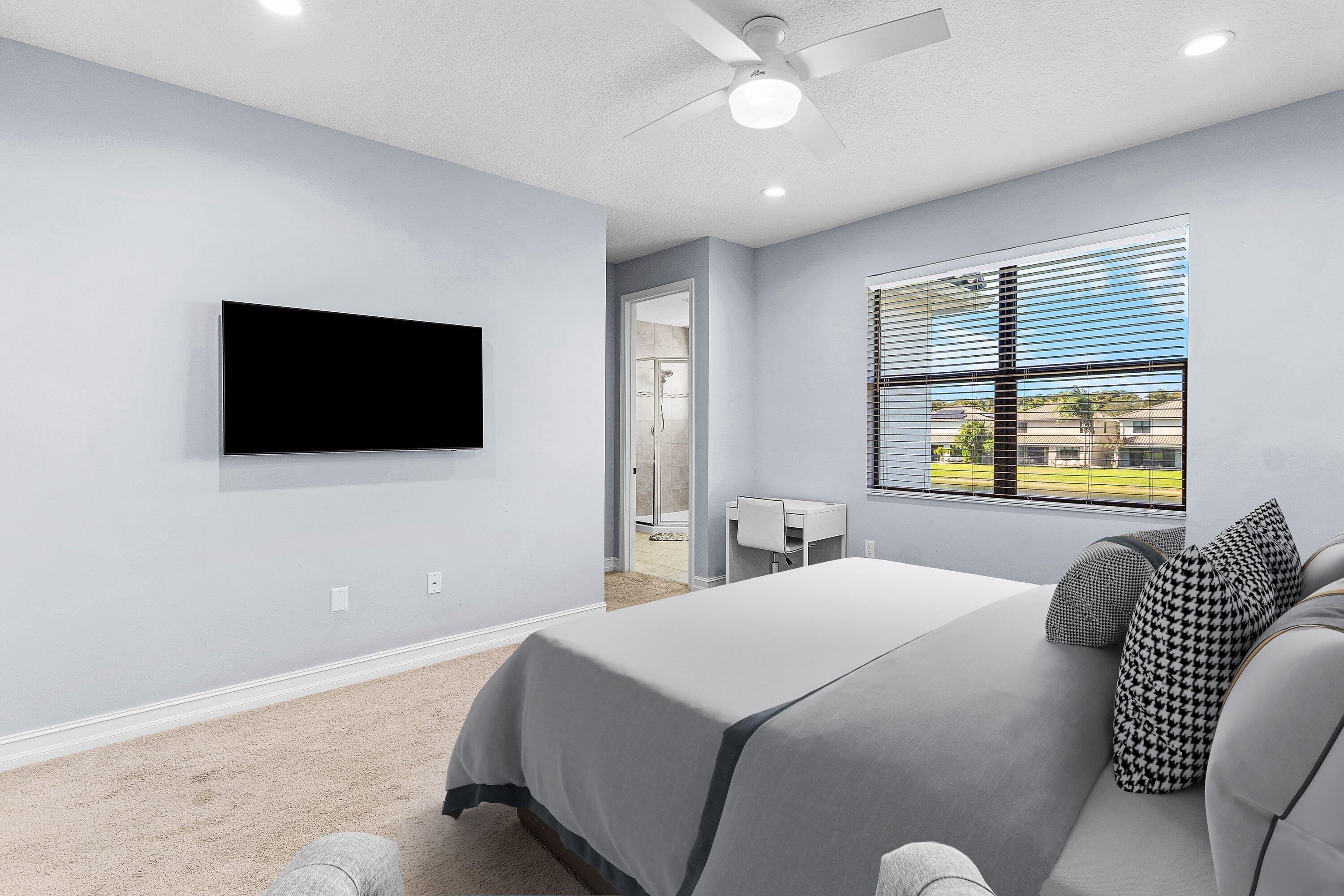 14125 Rock Salt Road Delray Beach, FL 33446 - Photo 16 of 55 a bedroom with a bed and a flat screen tv