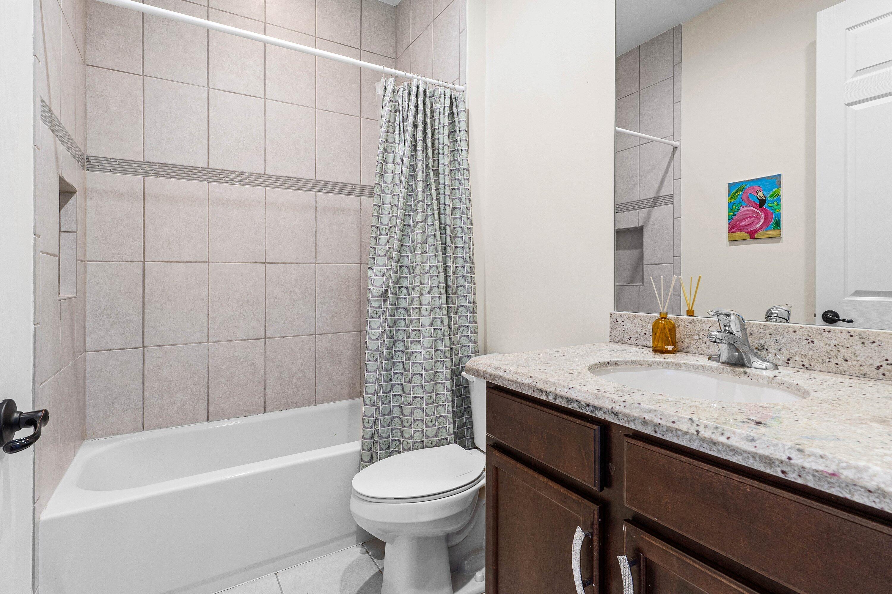 14125 Rock Salt Road Delray Beach, FL 33446 - Photo 23 of 55 a bathroom with a granite countertop sink a toilet and bathtub