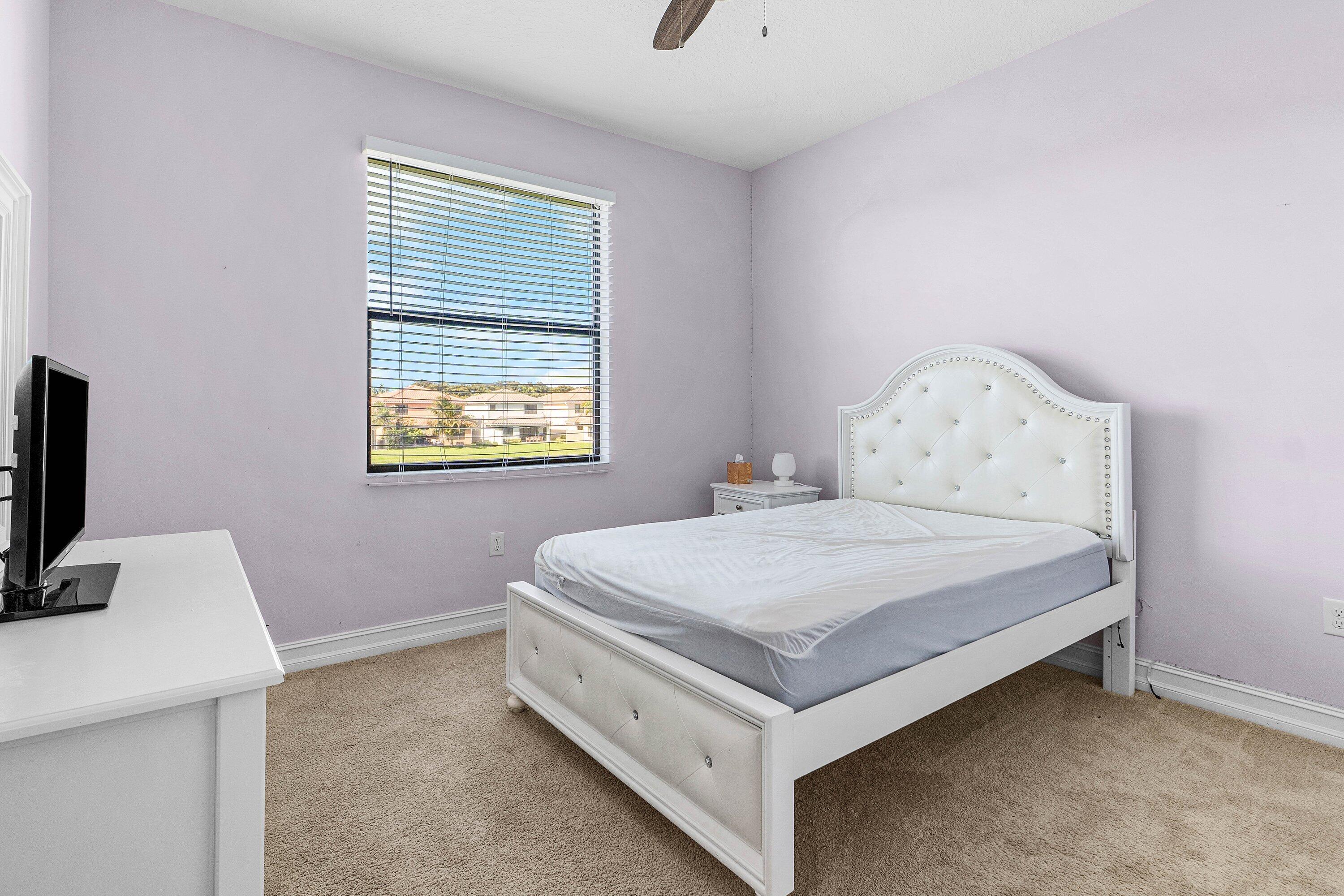 14125 Rock Salt Road Delray Beach, FL 33446 - Photo 24 of 55 a bedroom with a bed and a window