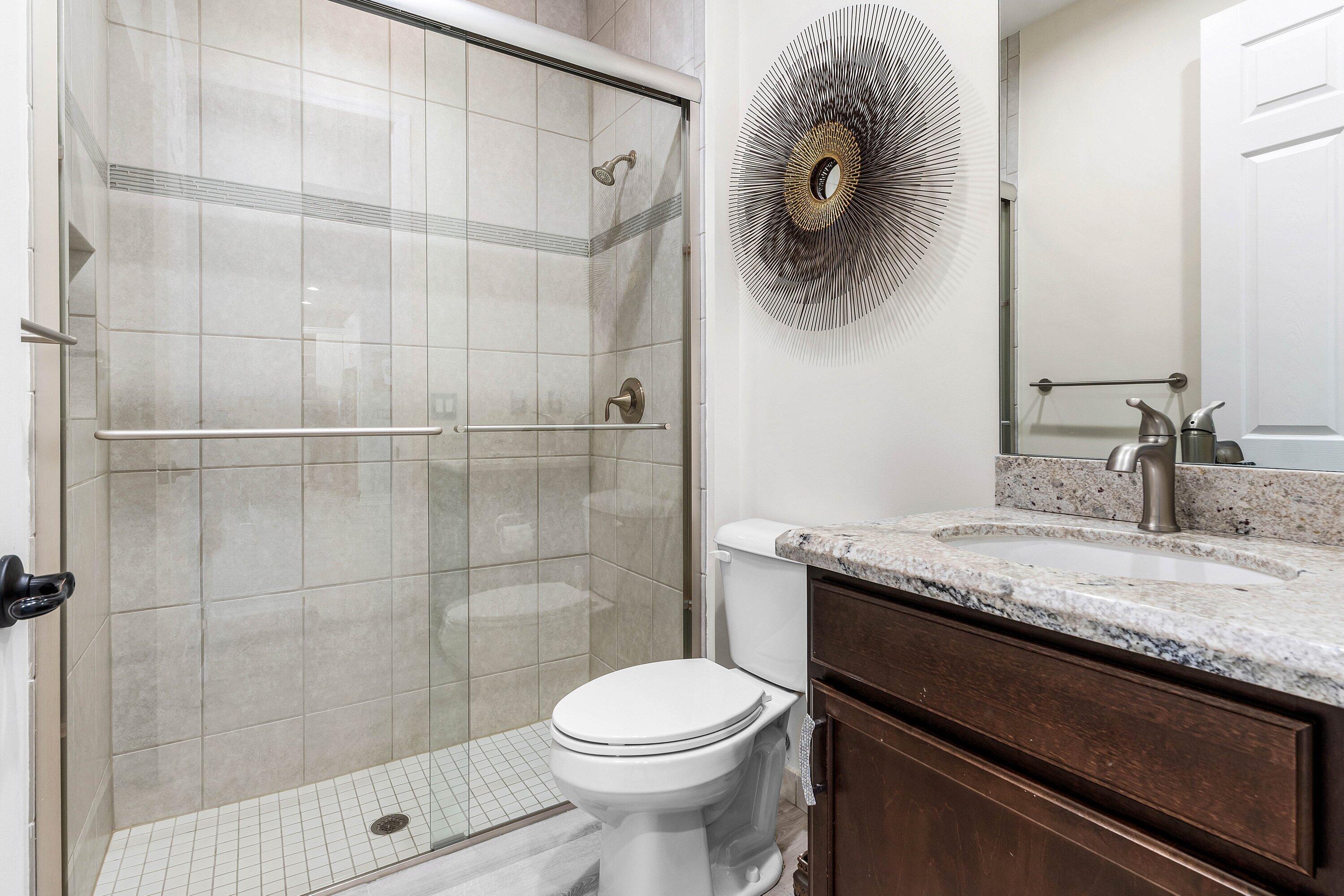 14125 Rock Salt Road Delray Beach, FL 33446 - Photo 27 of 55 a bathroom with a granite countertop sink a toilet and a mirror