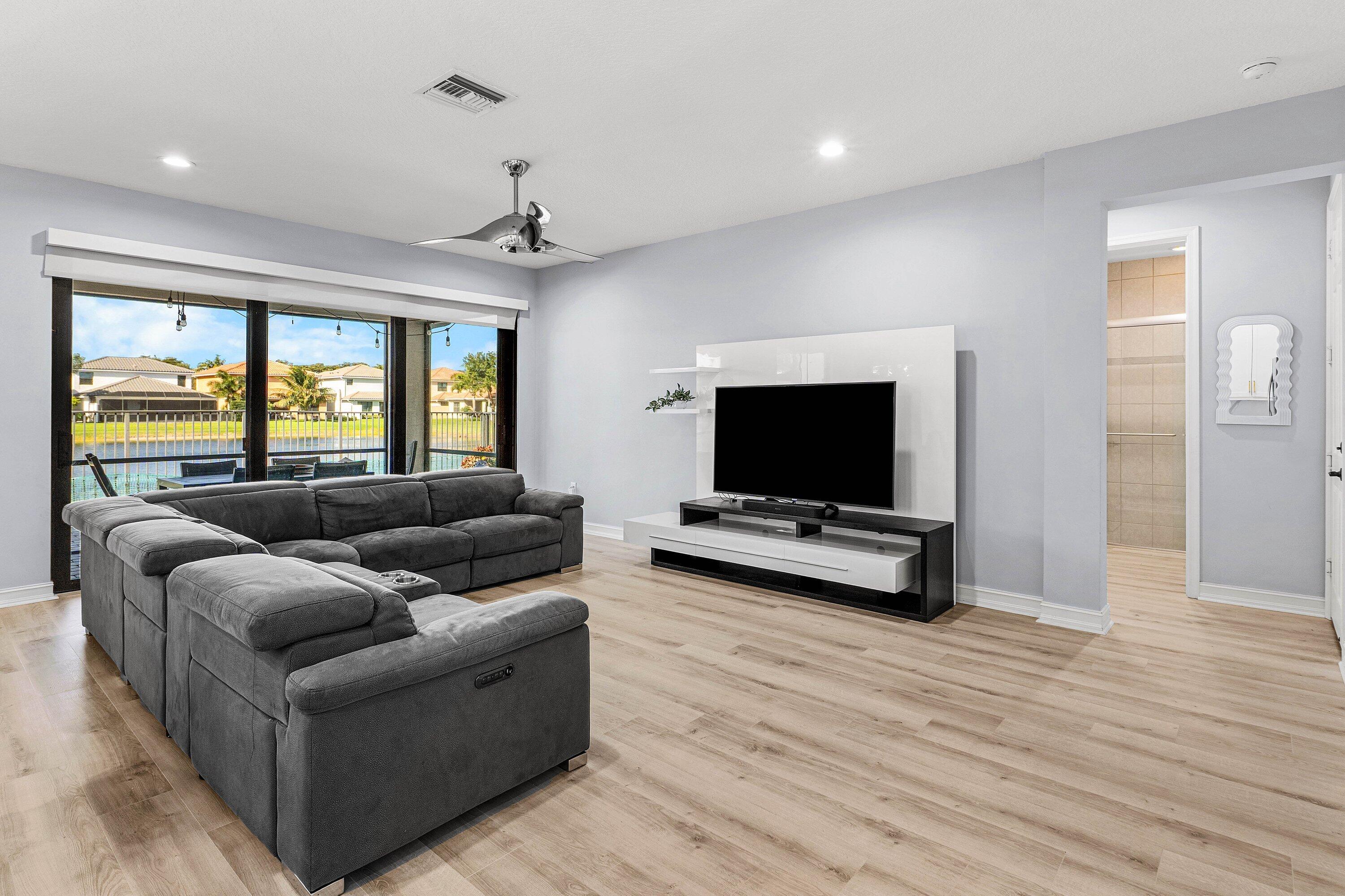 14125 Rock Salt Road Delray Beach, FL 33446 - Photo 7 of 55 a living room with furniture and a flat screen tv