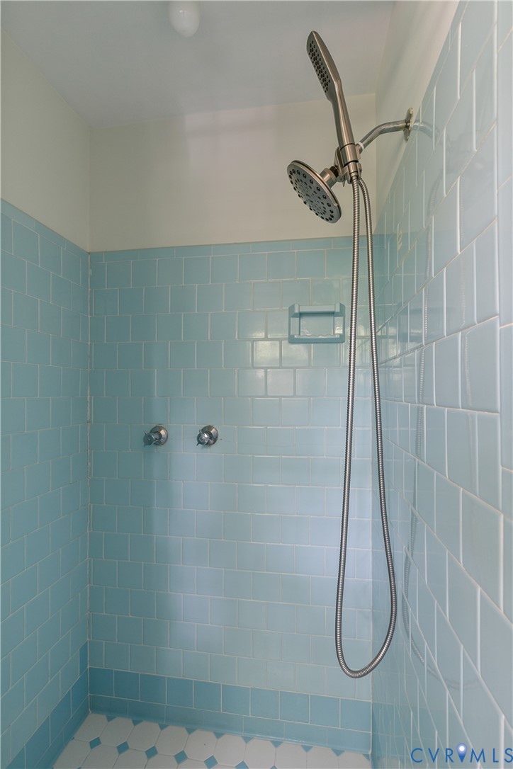 200 Stanmore Road North Chesterfield, VA 23236 - Photo 20 of 37 Shower stall featuring blue subway tile, an integr