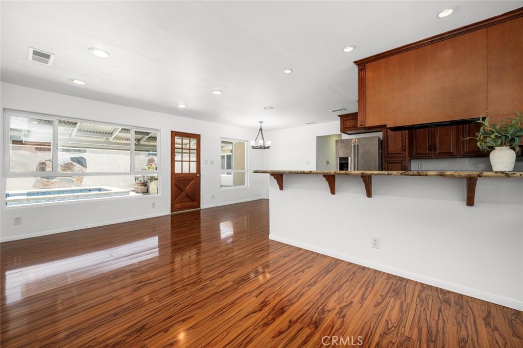 1238 North Studebaker Road Long Beach, CA 90815 - Photo 9 of 47 a view of a kitchen with wooden floor and a window