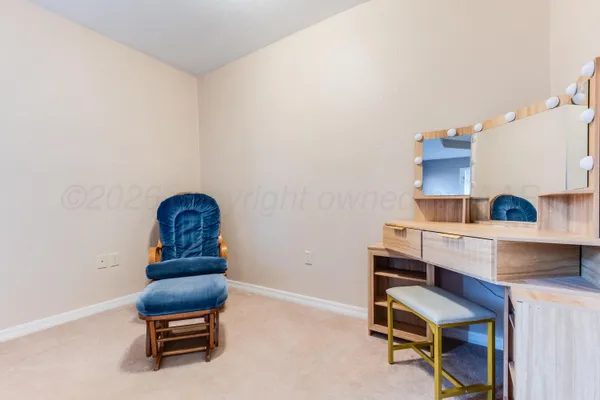a living room with furniture and a chair