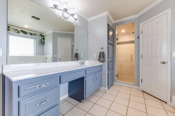 a spacious bathroom with a bathtub and a shower