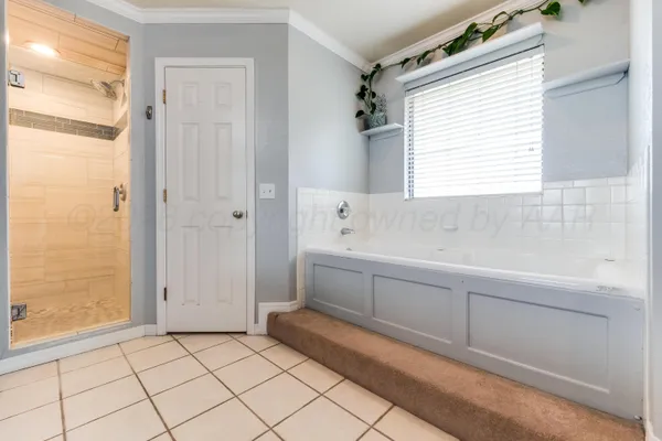 a spacious bathroom with a granite countertop sink mirror and double