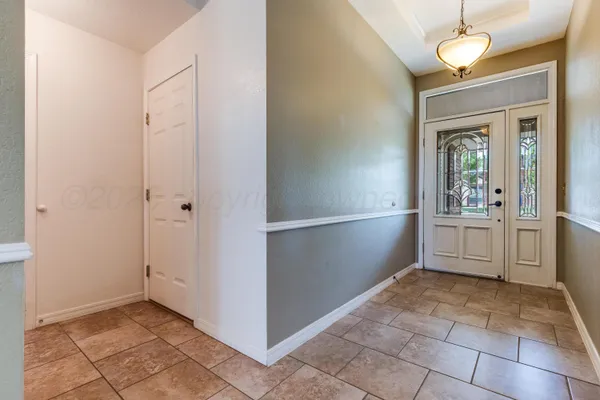 a view of a storage & utility room with closet cabinets