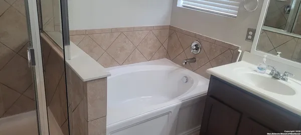 a bathroom with a sink and a bathtub