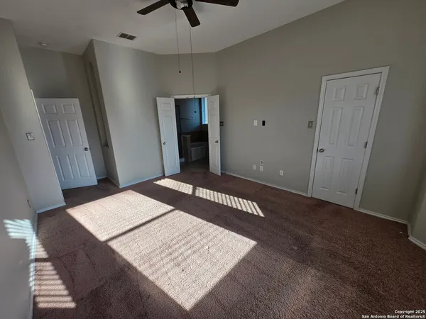 a view of a hallway of a house