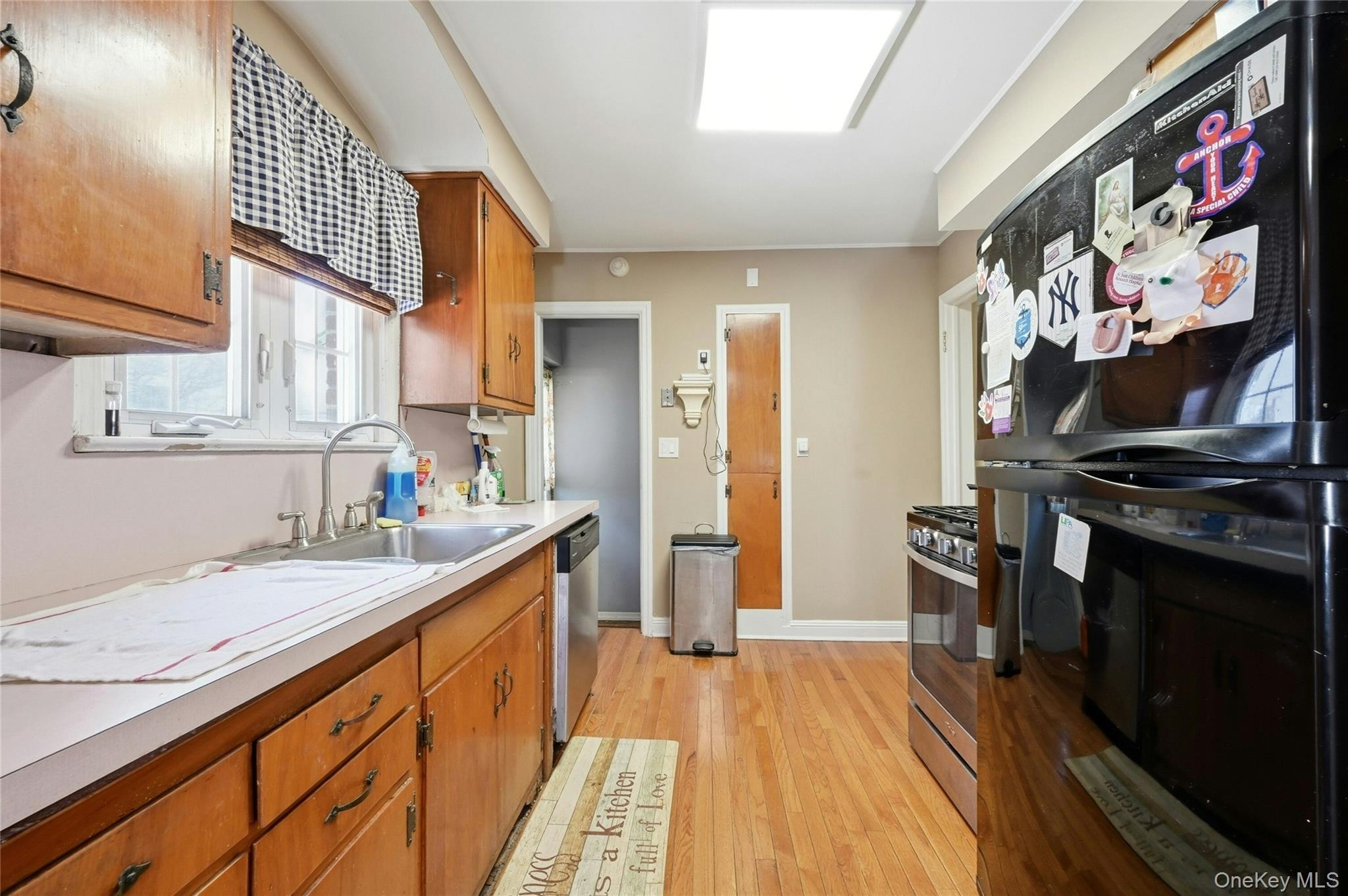 197 Foxhurst Road Oceanside, NY 11572 - Photo 14 of 28 Another View Of The Light & Bright, Cabinet Lined Kitchen.