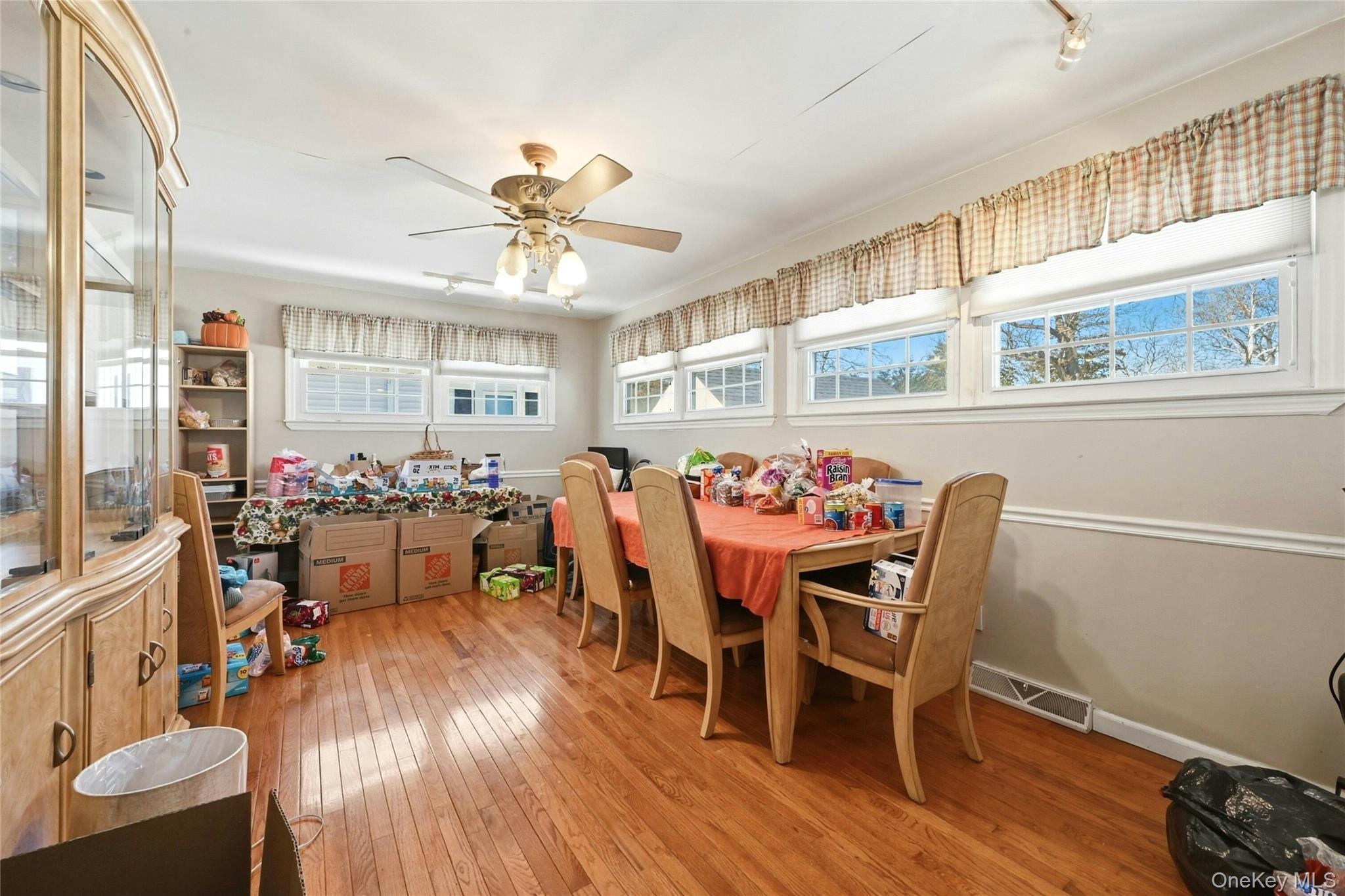197 Foxhurst Road Oceanside, NY 11572 - Photo 18 of 28 Off Of The Kitchen & Dinette Area Is The Large Den (Or Dining Room) Addition Offering Walls Of Beautiful Windows, Hardwood Floors, Ample Room For Furniture And A Door To The Large Patio & Backyard.