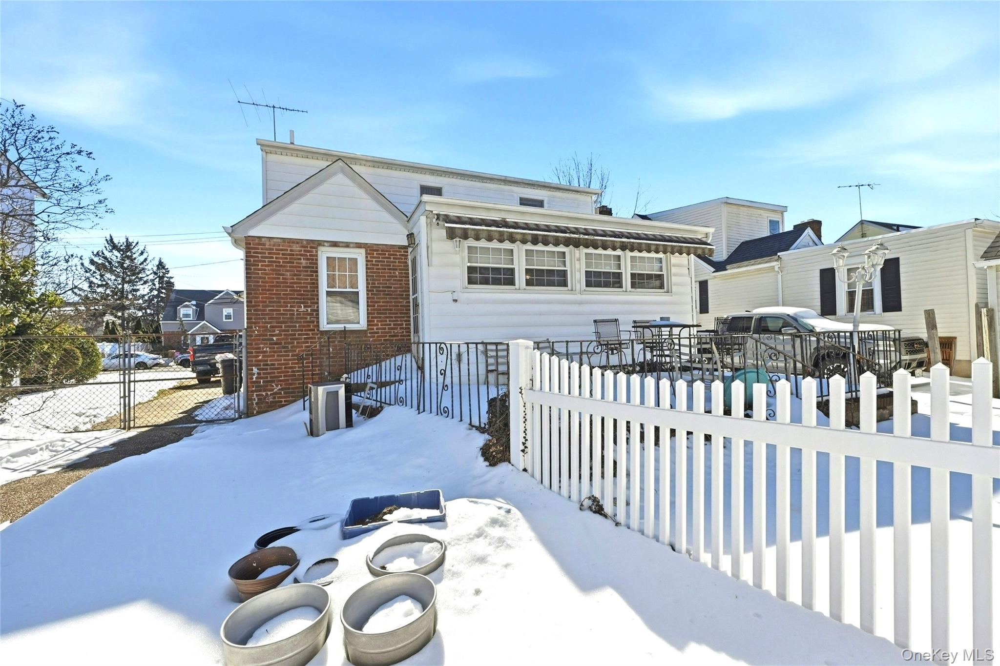 197 Foxhurst Road Oceanside, NY 11572 - Photo 25 of 28 Rear View Of The Home Showing The Den/Family Room (Or Dining Room) Extension & Large Patio.
