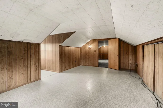 an empty room with wooden floor