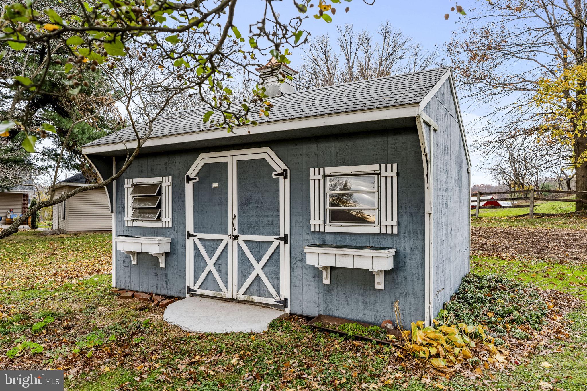 1245 West Swartzville Road Reinholds, PA 17569 - Photo 9 of 29 a front view of a house with a yard