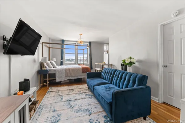 a living room with furniture fireplace and flat screen tv