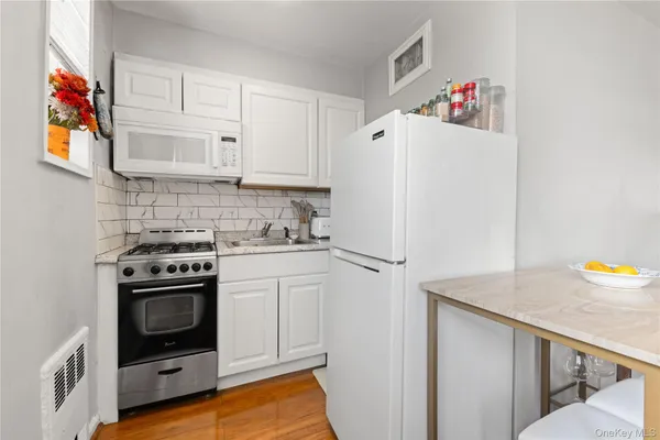 a kitchen with a stove and a refrigerator