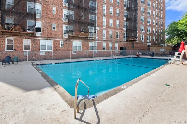 a view of a swimming pool with a lounge chairs