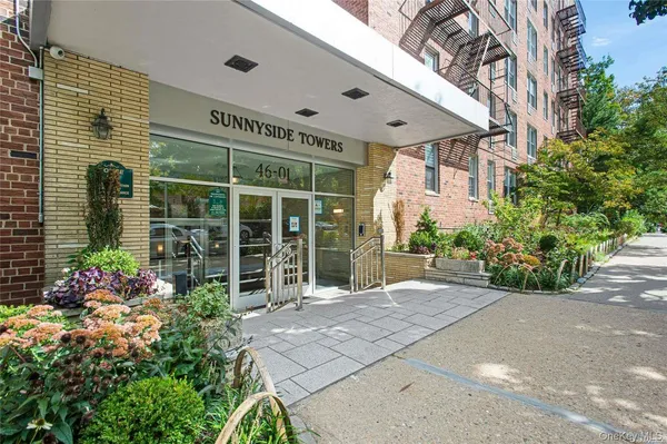 a front view of a building with garden