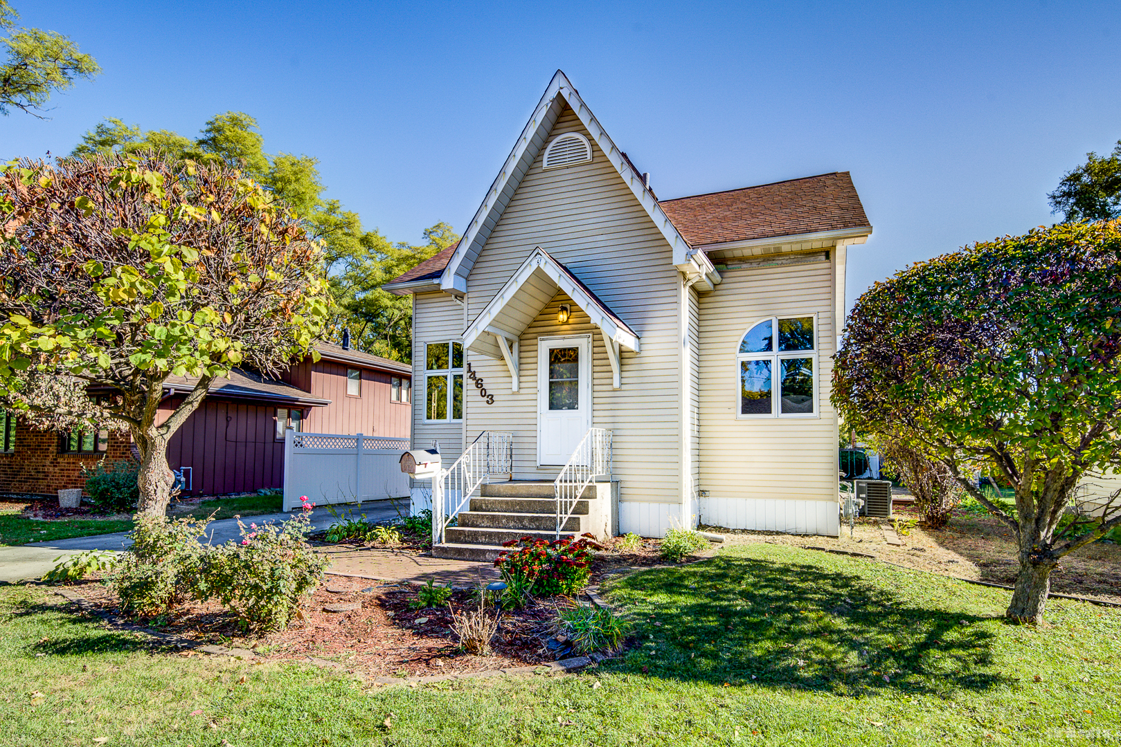 14603 Kenton Avenue Midlothian, IL 60445 - Photo 1 of 17 a front view of a house with a yard and garage