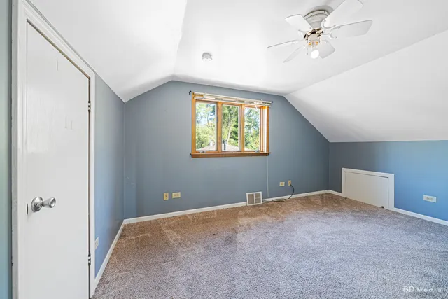 a view of room with a ceiling fan and window