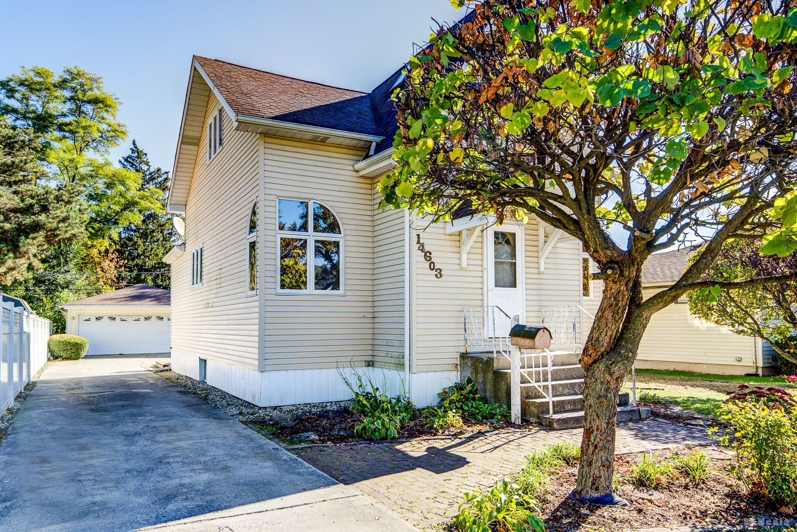 14603 Kenton Avenue Midlothian, IL 60445 - Photo 2 of 17 a front view of a house with garden