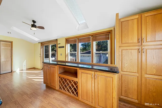 a view of a refrigerator and wooden floor