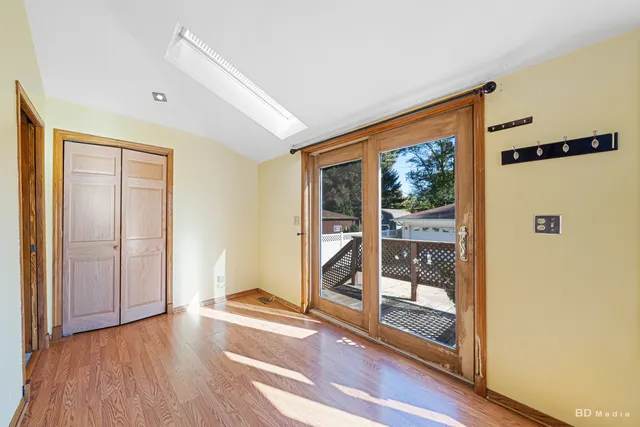 a view of front door with wooden floor