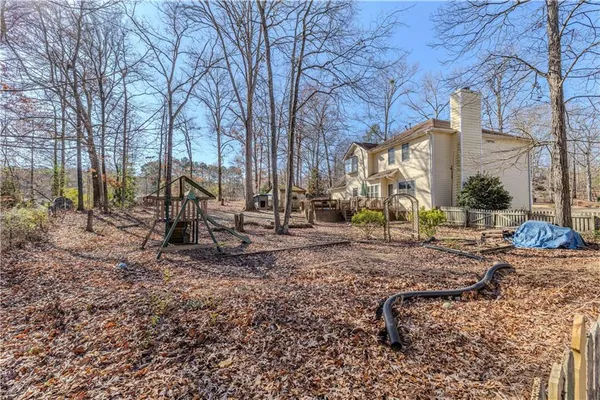 a view of a yard with a tree