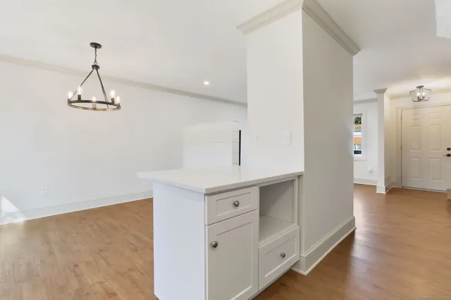 a kitchen with a refrigerator and cabinets
