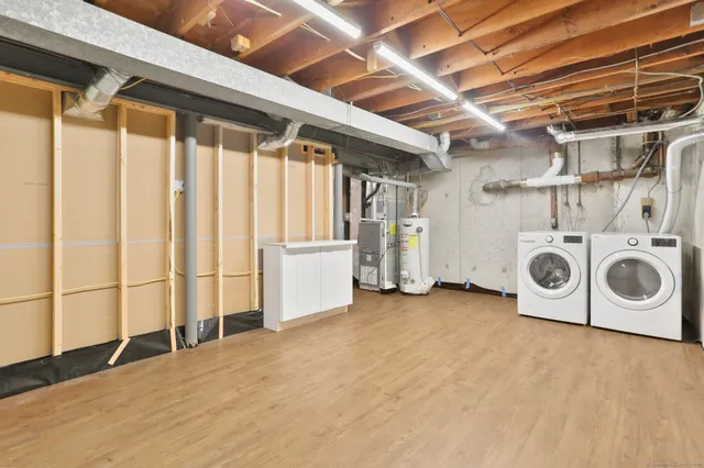 a view of a storage & utility room with washer and dryer