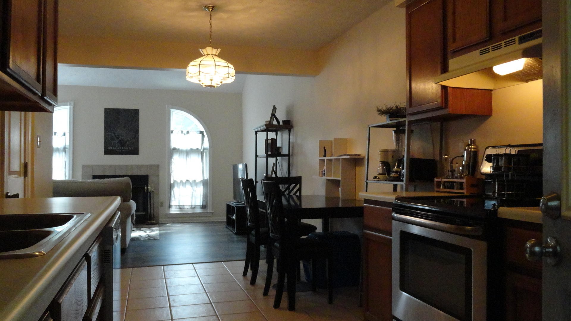 116 Hanover Place Oak Ridge, TN 37830 - Photo 3 of 17 a kitchen with stainless steel appliances a stove center island a dining table and chairs