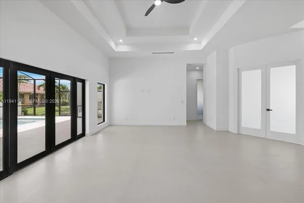 a view of empty room with floor to ceiling window