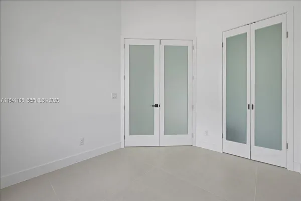 an empty room with closet area