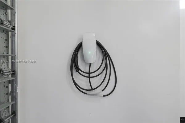 an empty room with a fireplace and windows