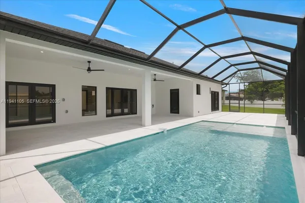a view of a house with backyard and porch