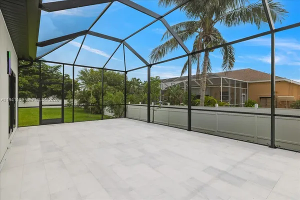 a view of house with backyard