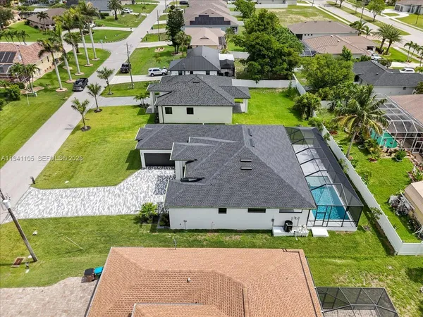 an aerial view of a house with a garden