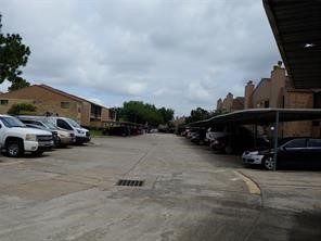 10555 Turtlewood Court, Unit 1511 Houston, TX 77072 - Photo 15 of 23 a view of street with parked cars