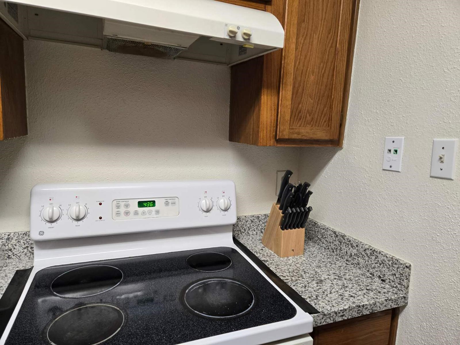 10555 Turtlewood Court, Unit 1511 Houston, TX 77072 - Photo 19 of 23 a kitchen with a stove and a sink