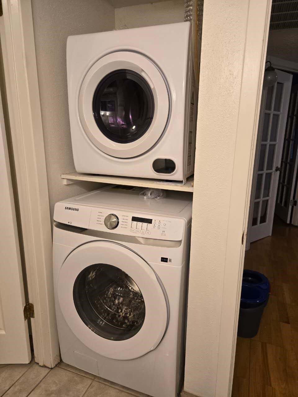 10555 Turtlewood Court, Unit 1511 Houston, TX 77072 - Photo 23 of 23 a utility room with dryer and washer