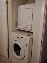 10555 Turtlewood Court, Unit 1511 Houston, TX 77072 - Photo 8 of 23 a utility room with dryer and washer