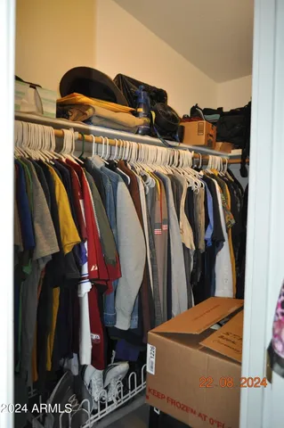 a bathroom with a toilet and a shower curtain