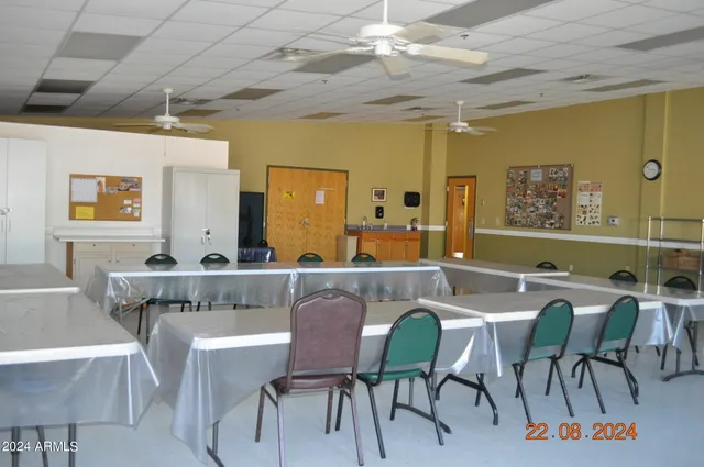 a view of a livingroom with furniture and a workspace