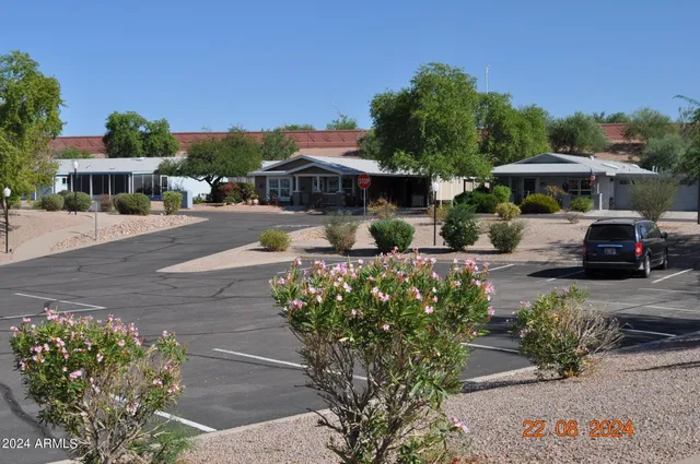 a view of a dining room with furniture and a bookshelf