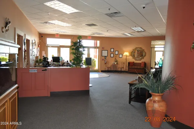 a view of a livingroom with furniture and a window