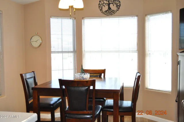 a workspace with furniture and chandelier