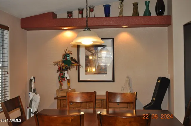 a view of a dining room with furniture window and outside view