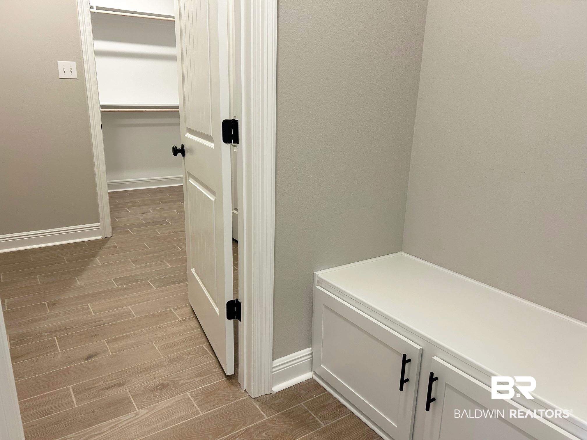 877 Sumter Loop Foley, AL 36535 - Photo 12 of 18 Interior space featuring baseboards and wood tiled floor