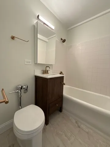 a bathroom with a sink a toilet and a bathtub